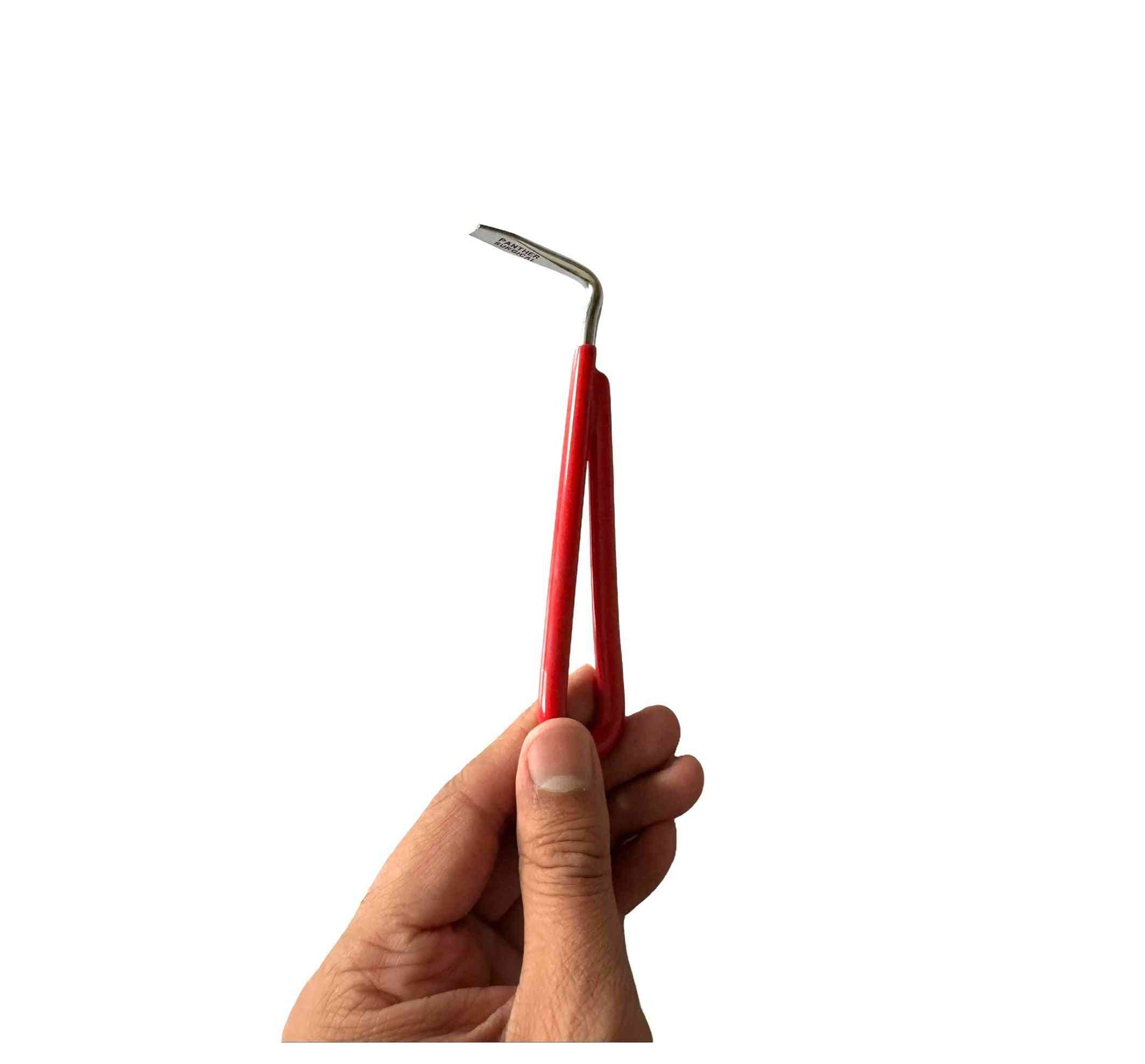 Red-handled hoof care pick for horses with a durable metal tip. Essential farrier tool for hoof cleaning and maintenance in equestrian grooming kits.